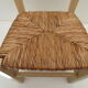 Children's chair of greige color in wood and straw