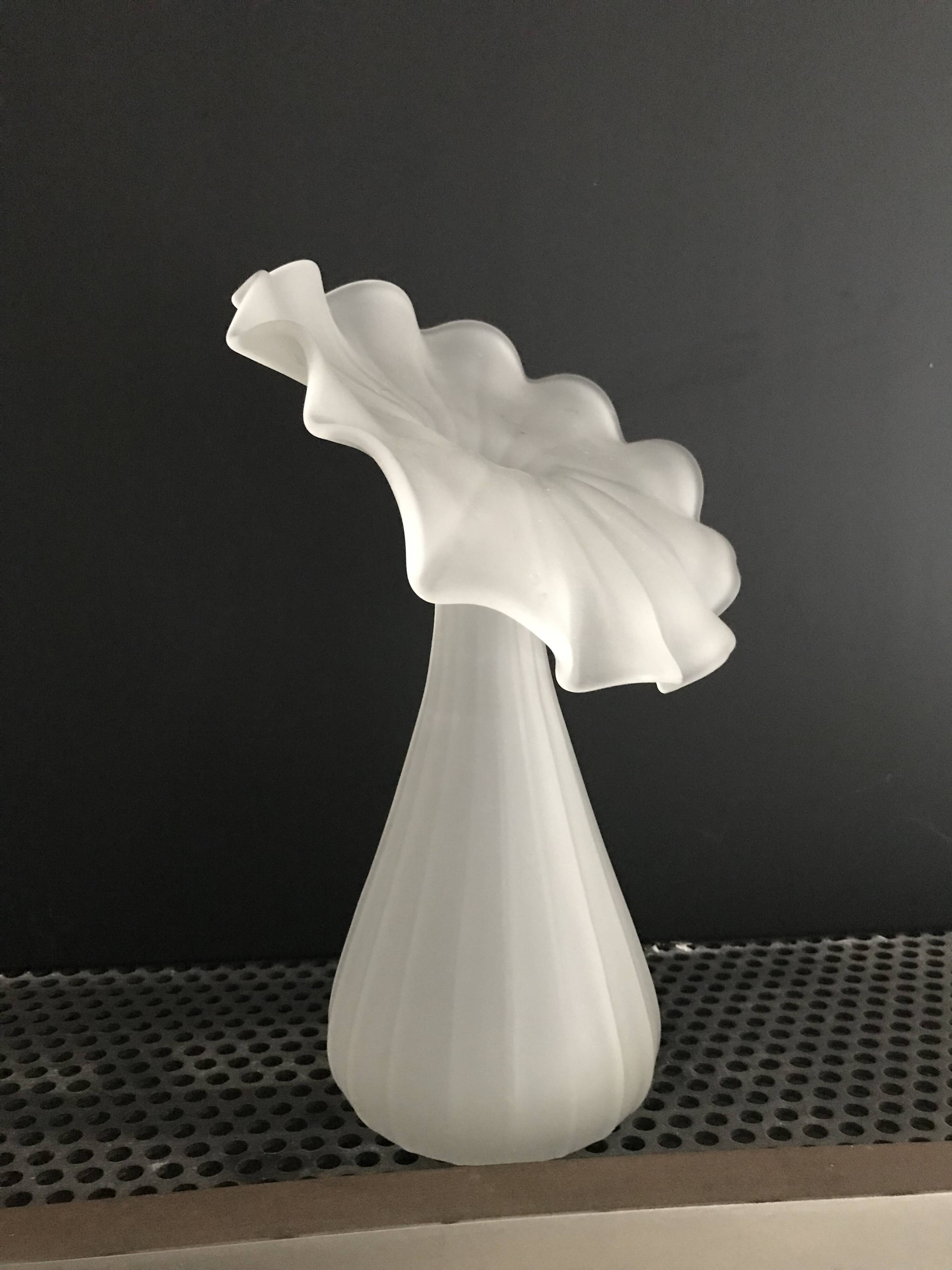 Vintage satin white glass vase with a wavy corolla