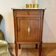 Antique bedside table in wood and marble – adorned with gilded brass ornaments –