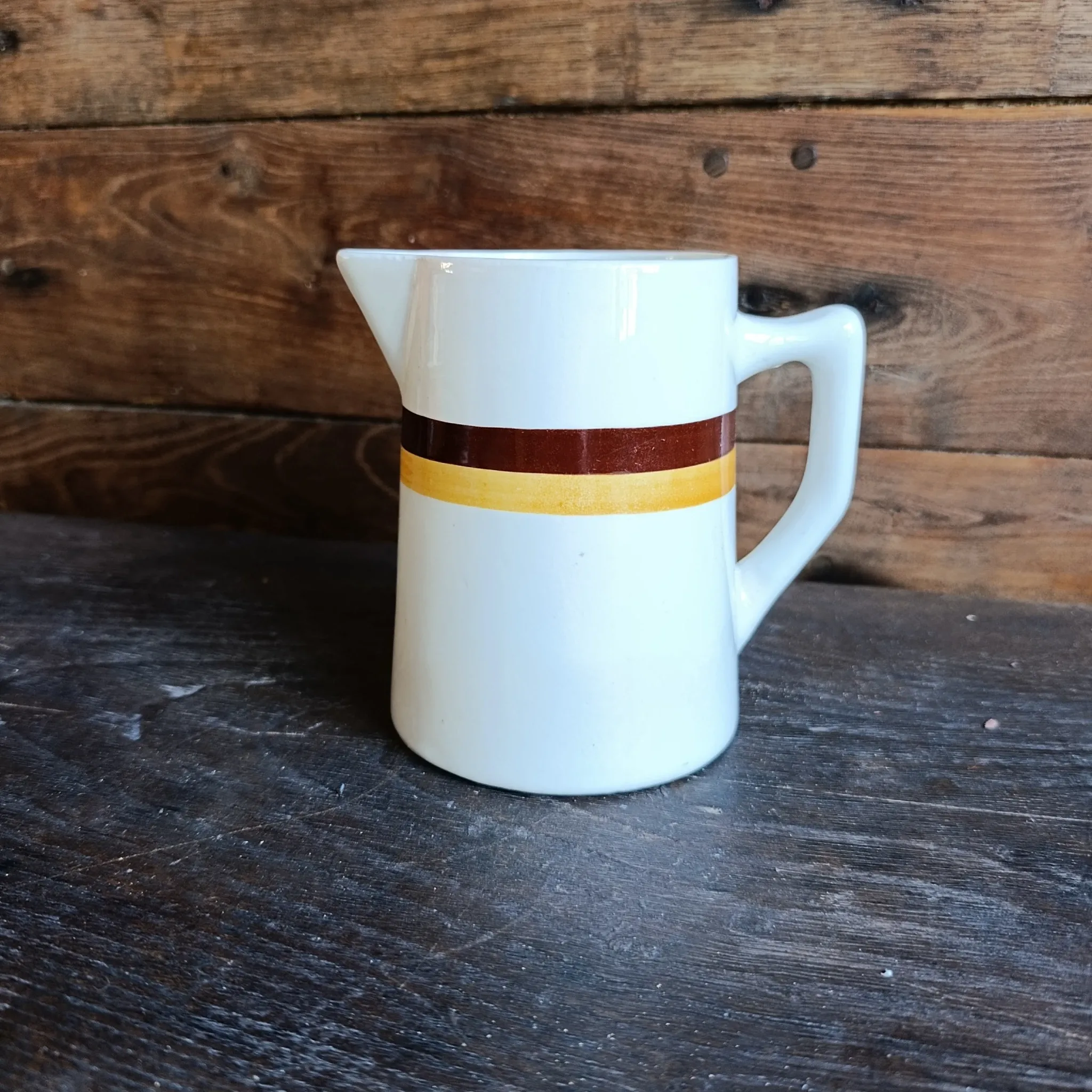 Vintage French ceramic pitcher with brown and ochre stripes