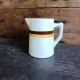 Vintage French ceramic pitcher with brown and ochre stripes