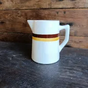 Vintage French ceramic pitcher with brown and ochre stripes