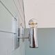 Pair of tubular wall sconces in chrome metal, 1970.