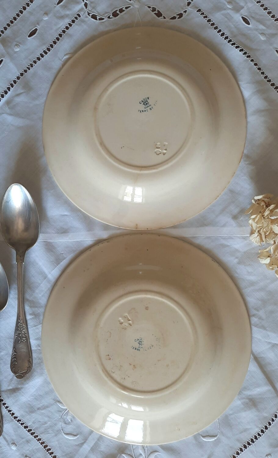 Old mismatched hollow plates in iron earth earthenware