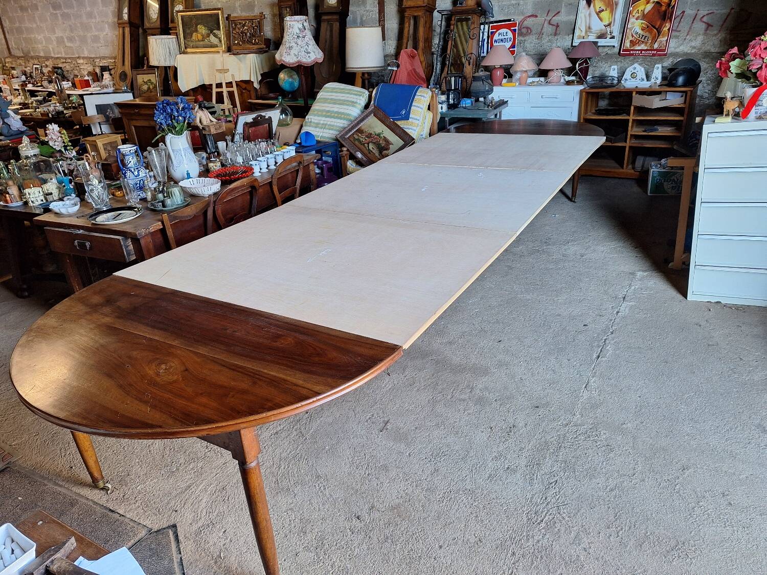 Old walnut carpenter's table, extendable for 18 people.