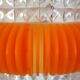 Transparent plastic space age lustre with orange band from the 70s.