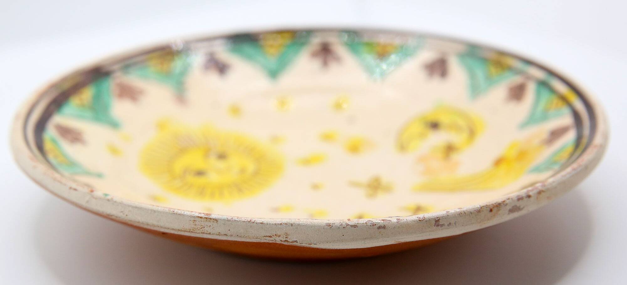 Handmade plate with moon and sun in Romania