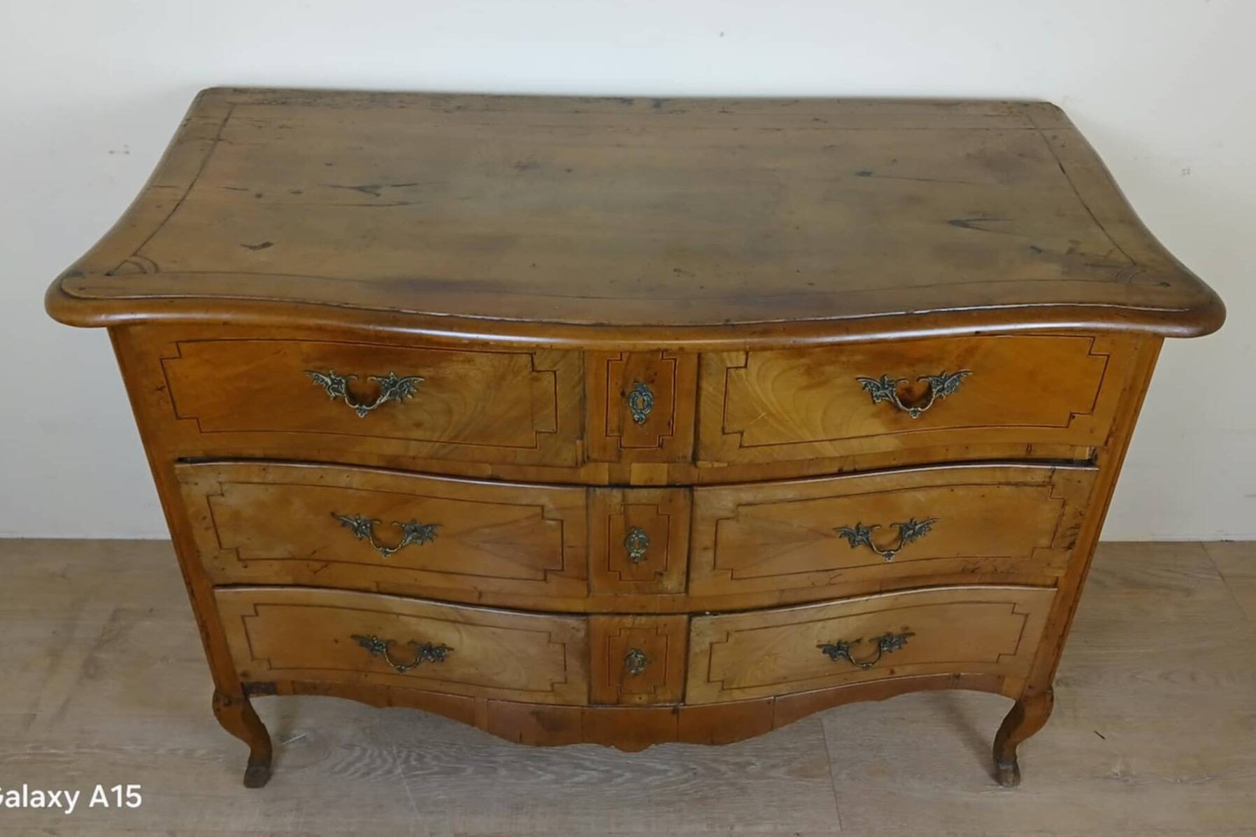 Louis XV period curved chest of drawers in elm and marquetry fillets circa 1750