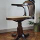Vintage swivel office chair with curved wood and caning (Thonet style)