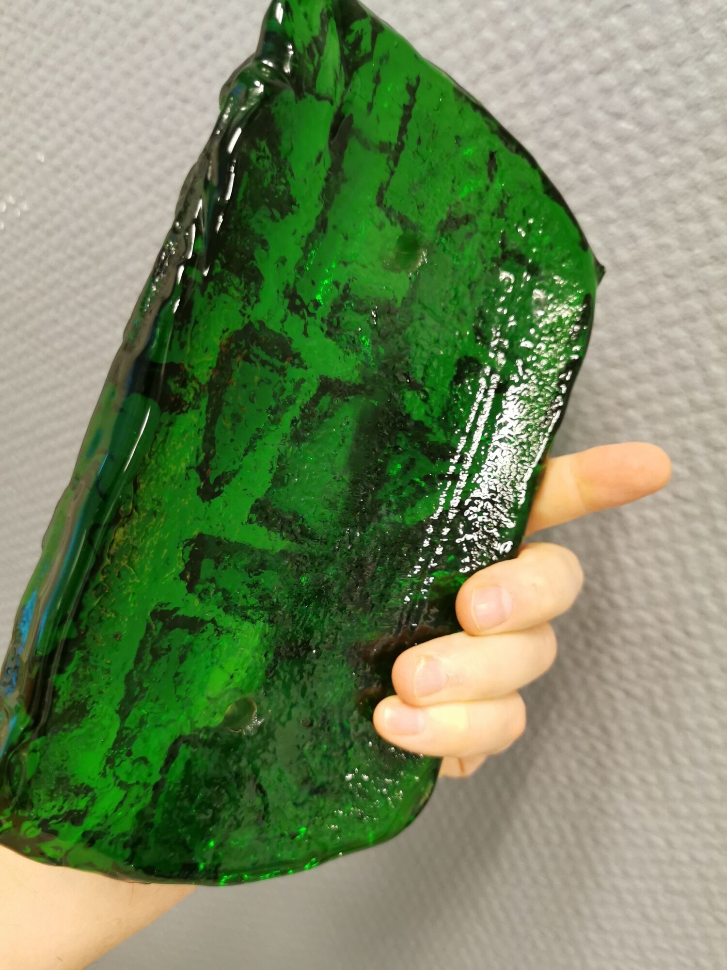 Old wall lamp made of hard pressed green glass.
