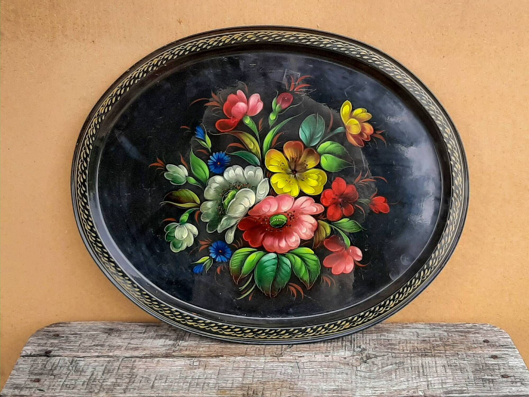 Black lacquered metal tray with multicoloured vintage Russian floral decoration.