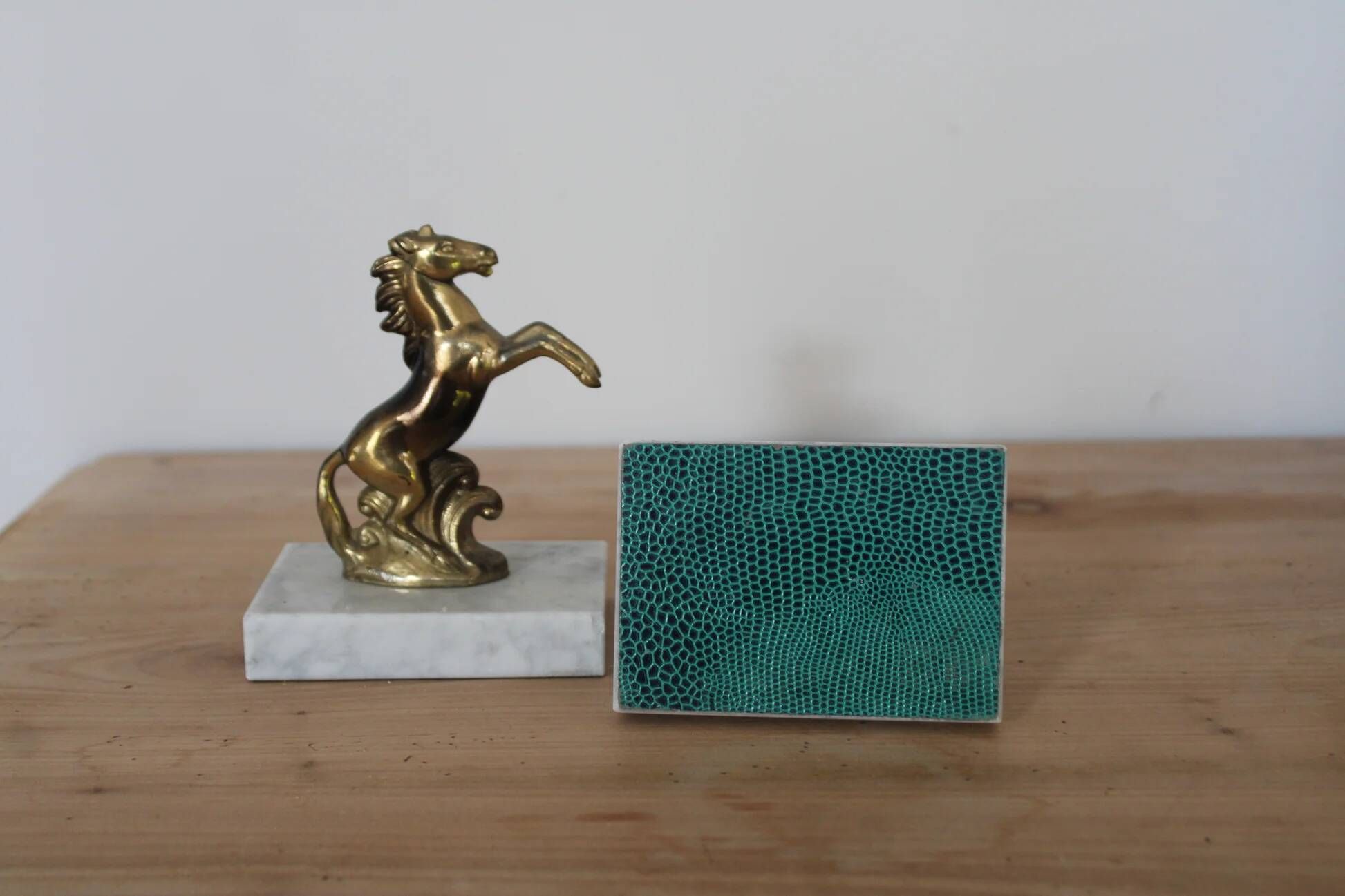 Pair of vintage bookends with rearing horses in gilded metal on marble bases.