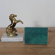 Pair of vintage bookends with rearing horses in gilded metal on marble bases.