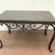 Table basse en fer forgé et marbre XX siècle