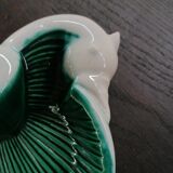 Empty green and white ceramic bird pocket