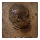 Workshop plaster medallion by Ch. Filleul, head of a young child, 20th century