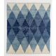 Tapis en laine contemporain avec des diamants bleus entrelacés.