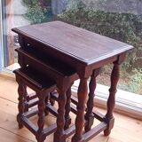 Nesting tables in oak wood. Turned wooden legs.