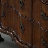 Antique baroque oak commode from the late 18th century with cabriole legs.