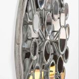 Mirror with round facets design