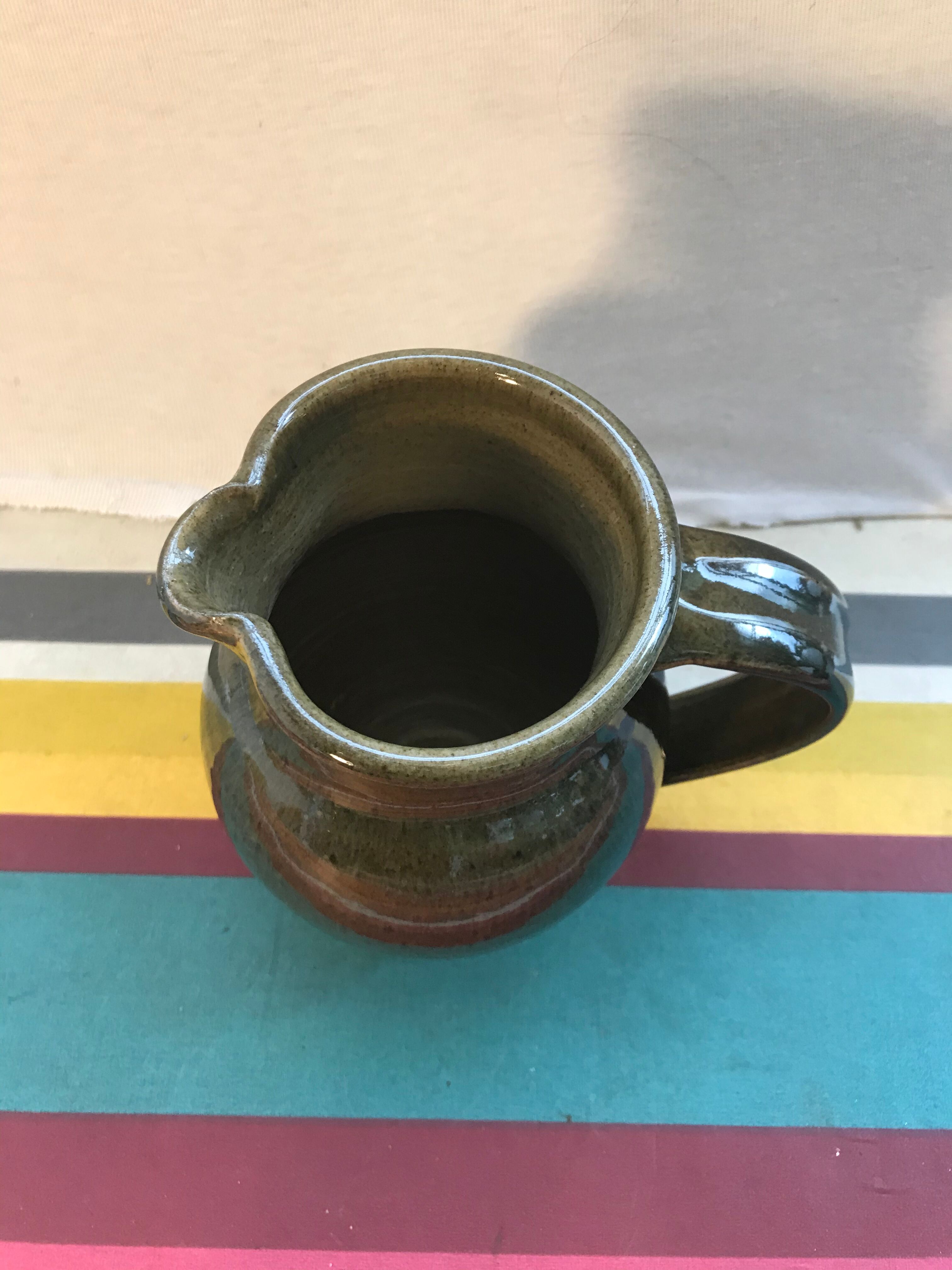 Former green enamelled sandstone pitcher