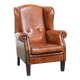 Wingback chair made of sheep leather with black piping in good condition