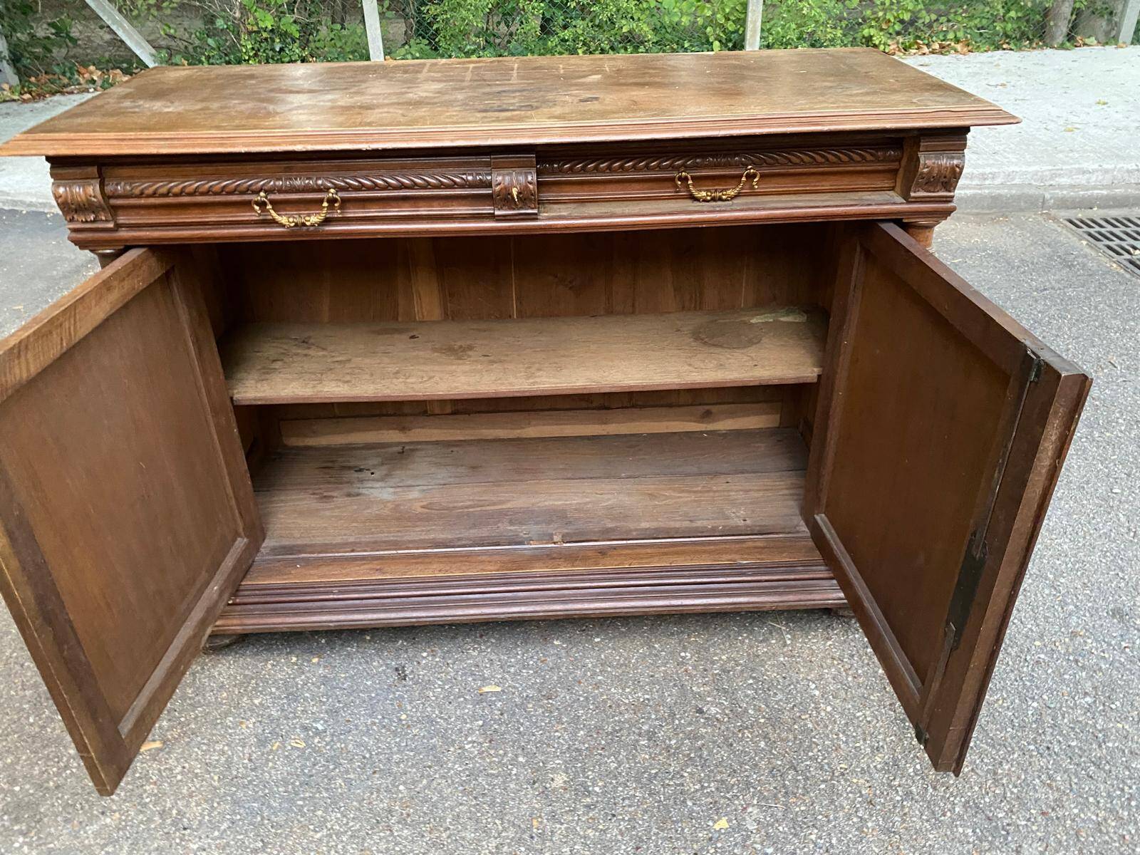 Henri II sideboard in carved wood, 1930.