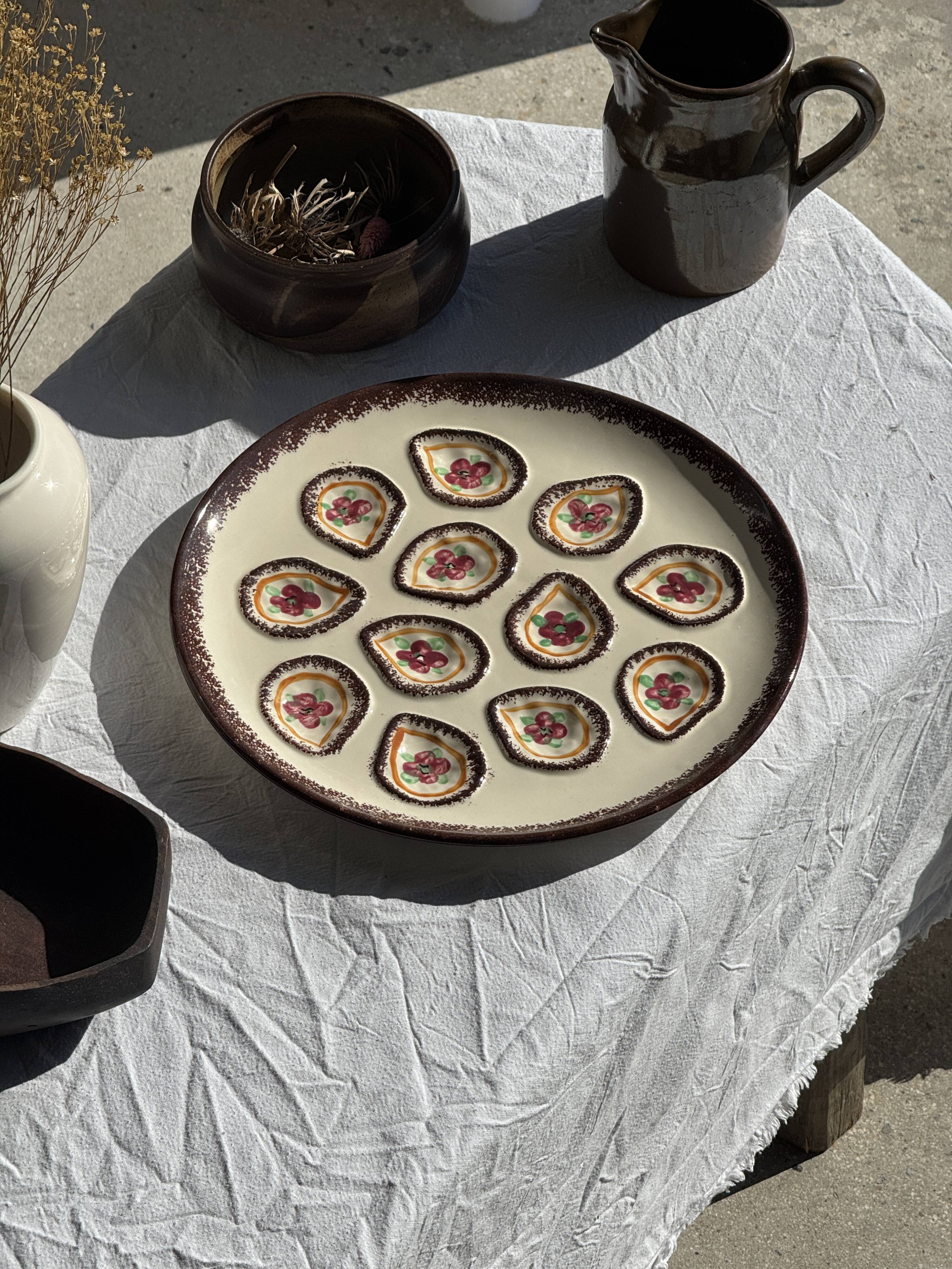 Large circular platter with compartments for shellfish, molluscs, and oysters.
