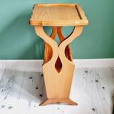 Side table with wooden and cane magazine holder