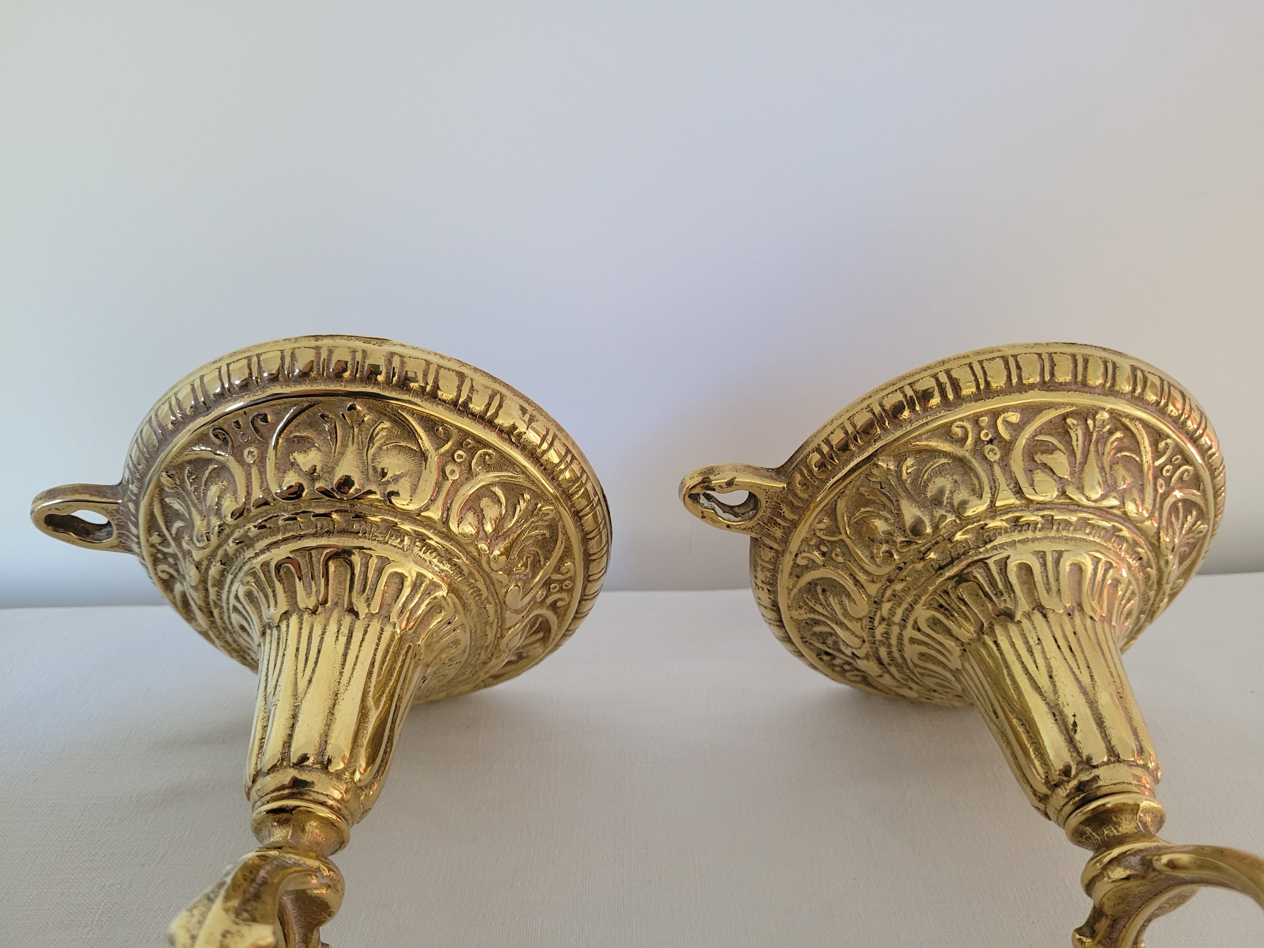 Duo of brass balance wall candle holders