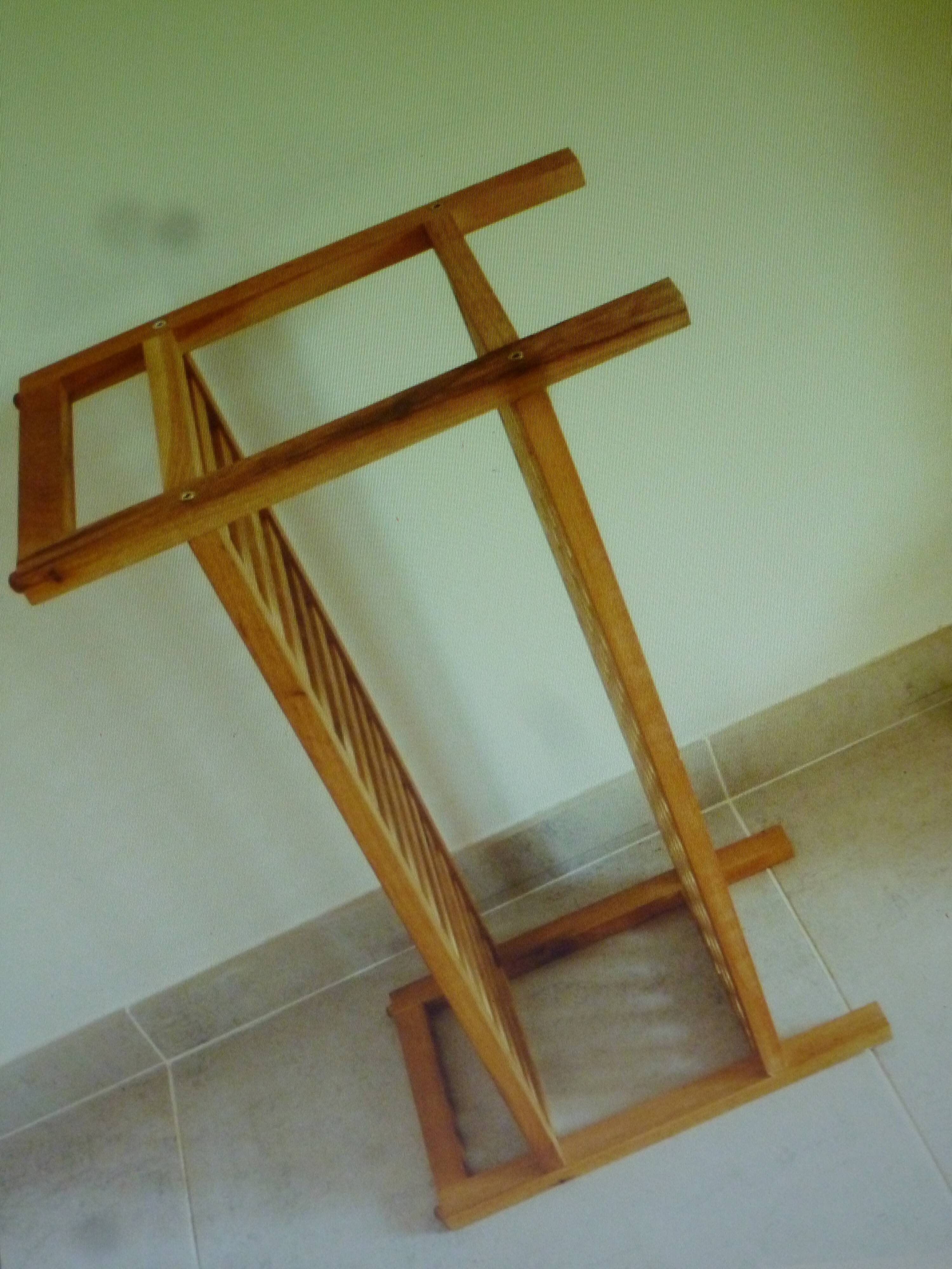 Wooden coffee table with openwork shelves and garden plant holder.