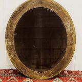 Large golden oval mirror