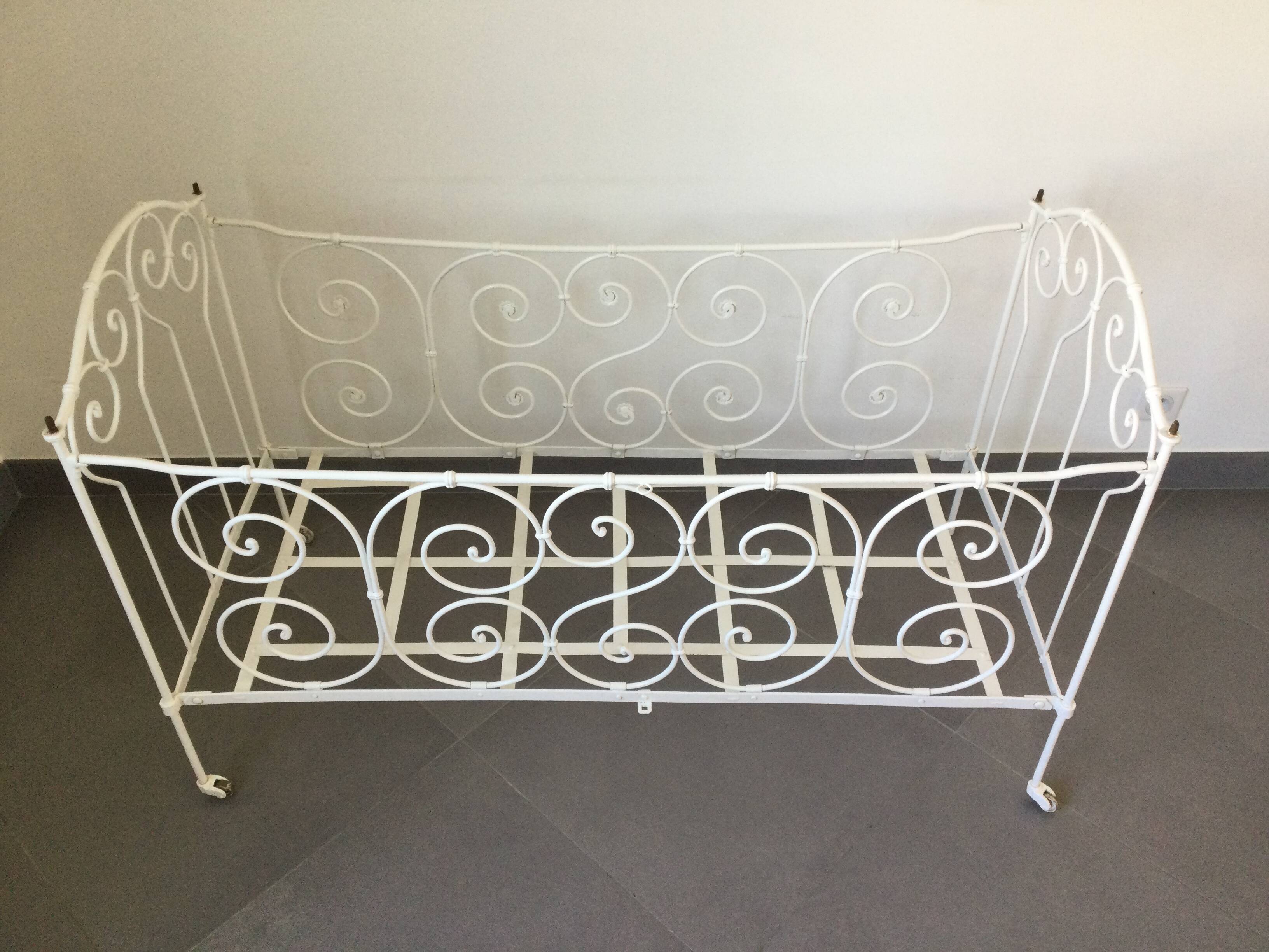 White wrought iron folding bed