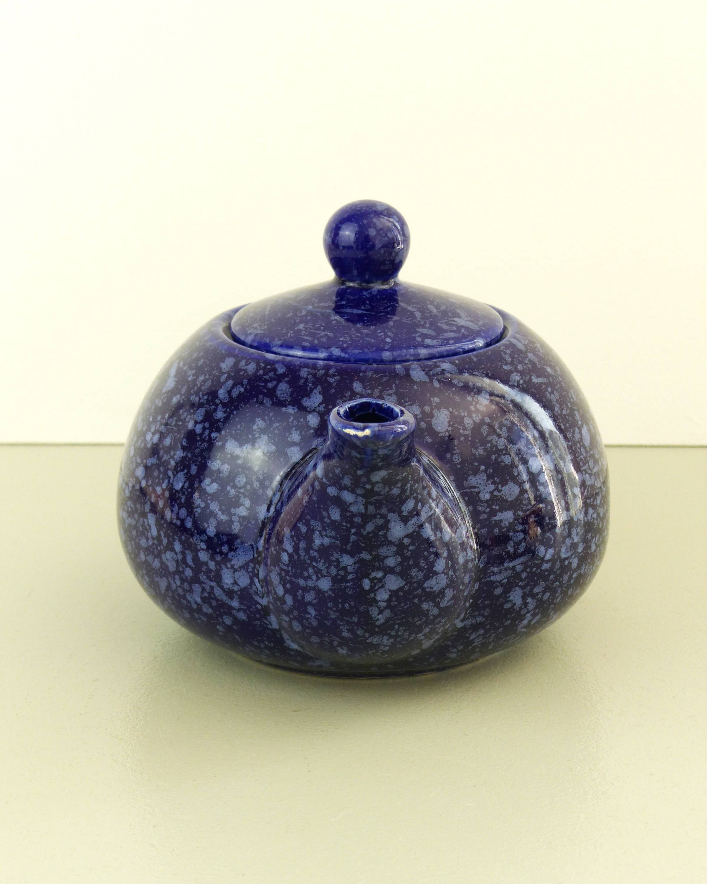 Blue glazed and speckled ceramic teapot