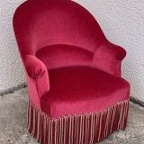 Old raspberry velvet toad armchair