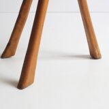 Brutalist tripod stool in carved wood, 1950s