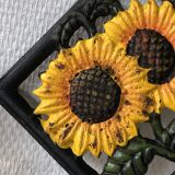 Cast iron trivet with sunflower decor