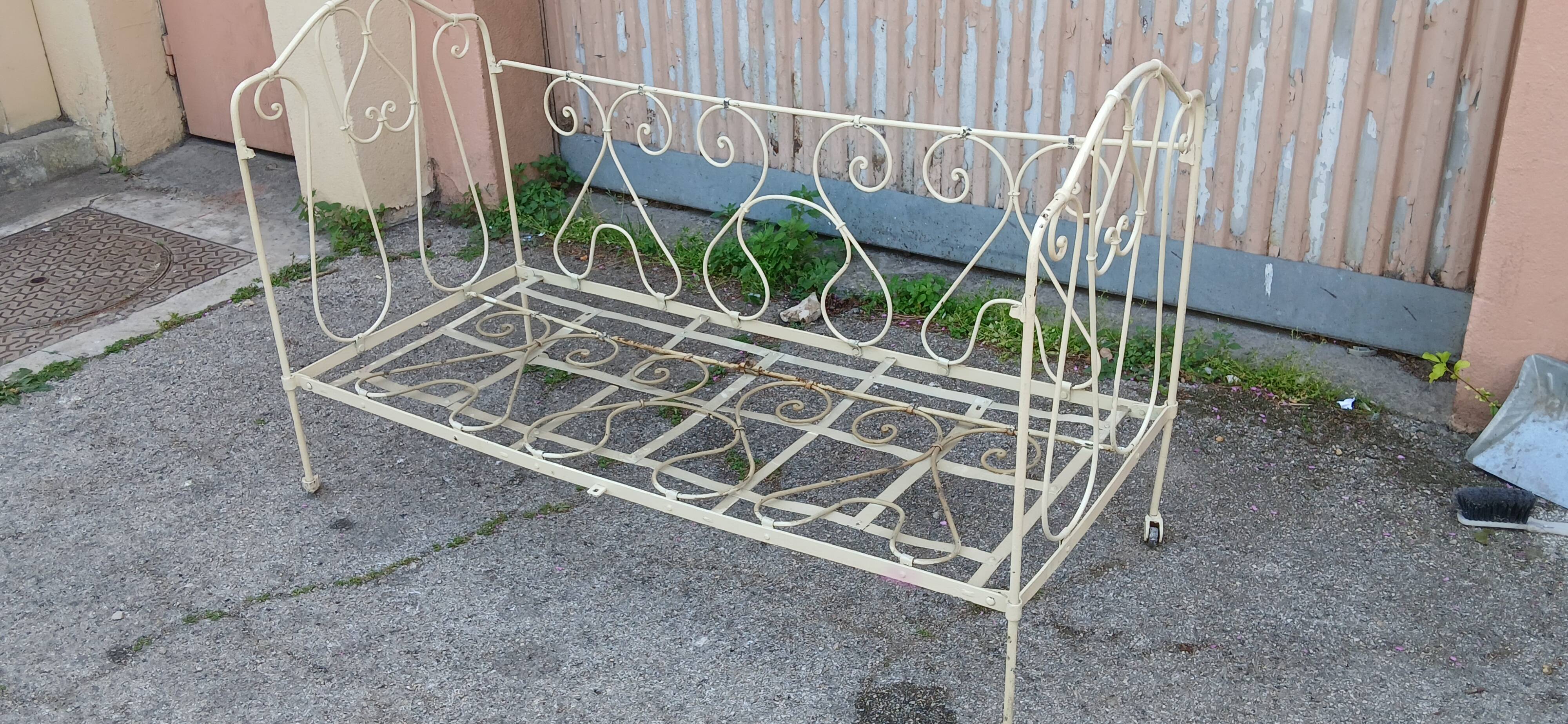 Magnificent bench/antique wrought iron bed.