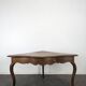 Louis XV corner table in walnut with curved legs.
