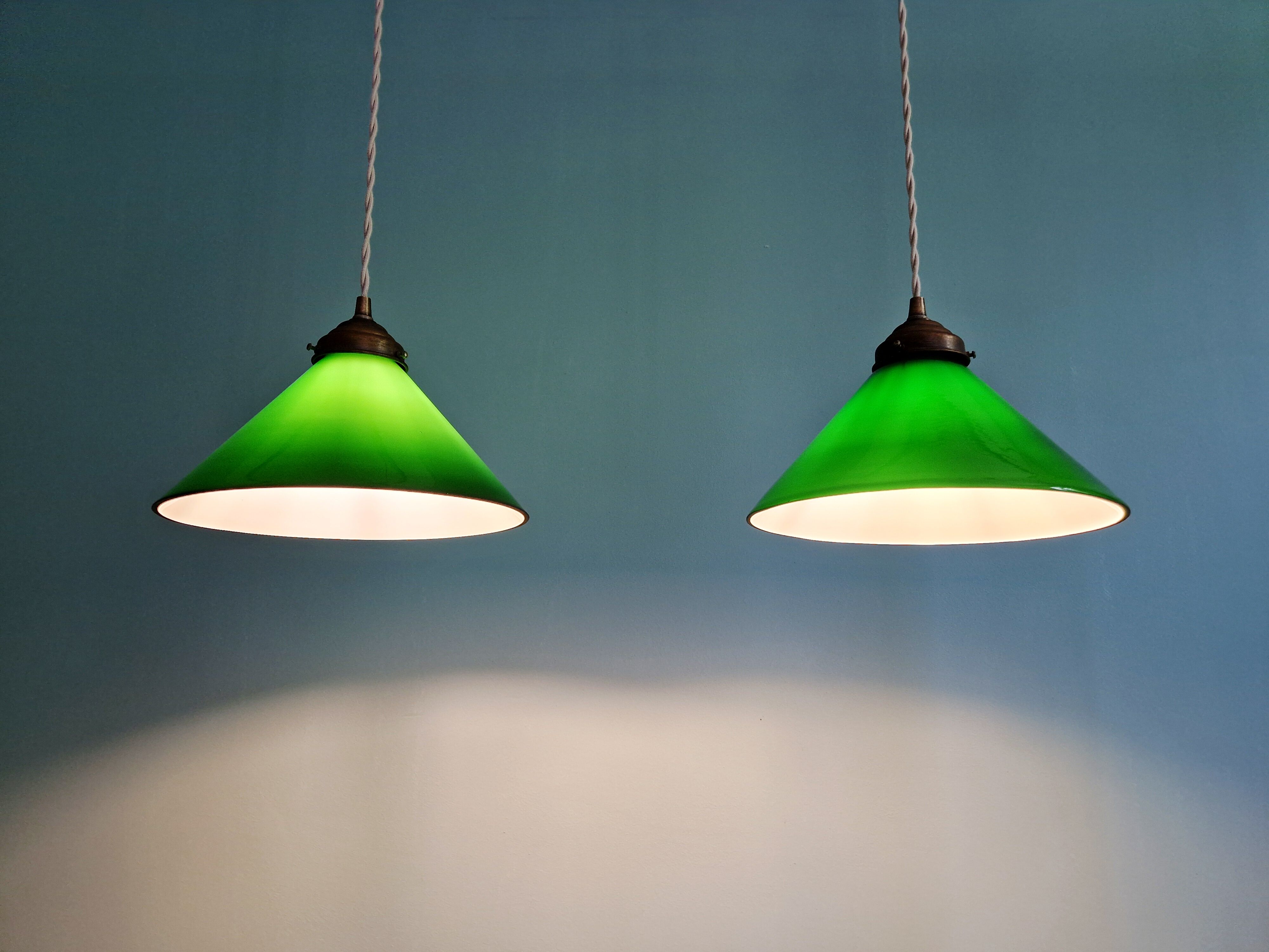Pair of conical green opaline pendant lights, Art Deco style