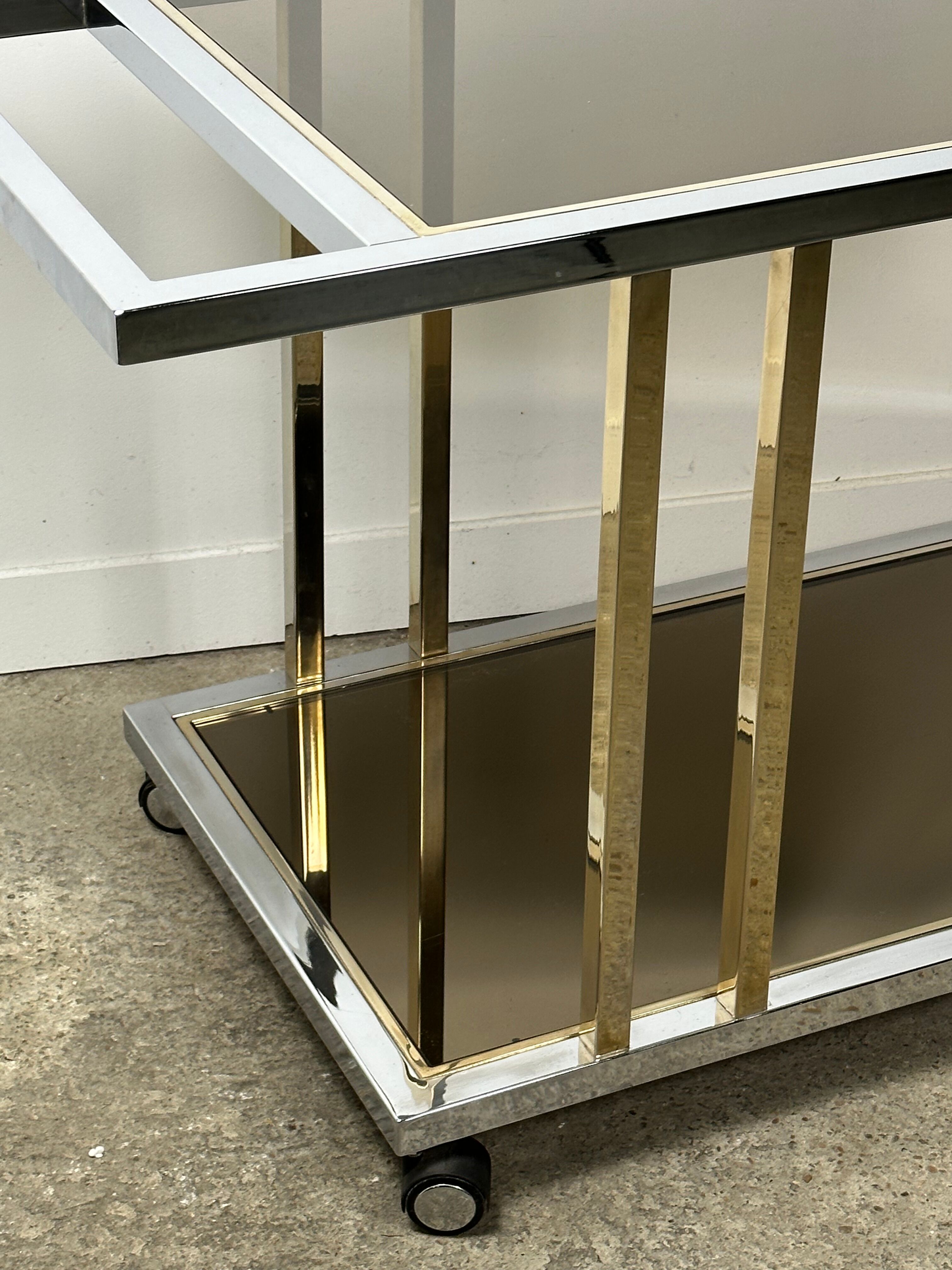 Belgo chrome serving cart/rolling table in chromed and gold-plated brass, 70s