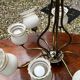 Vintage 8-light chandelier in brass and frosted white and gold glass.