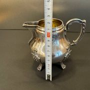 Antique silver-plated metal milk jug – Rococo style, chased decoration, early