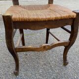 Solid oak carved chair with rush seating, Louis XV style, 19th century.