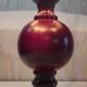 Turned wood table lamp in plum color - 1970s
