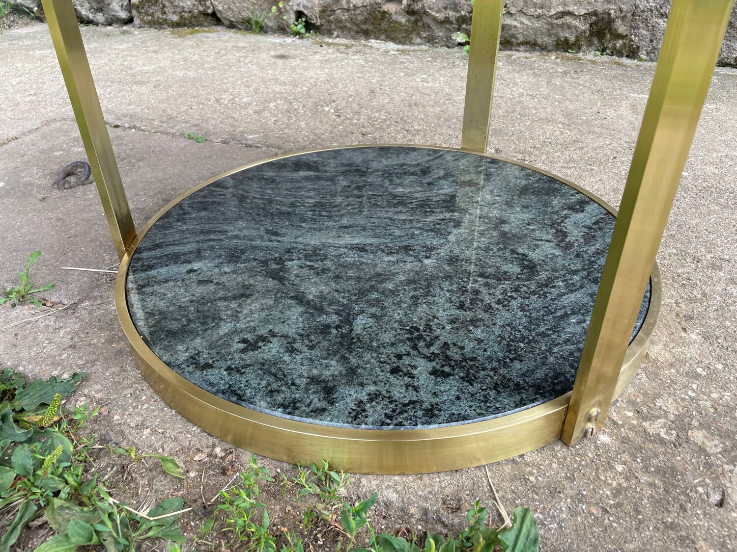 Round dining table with green marble and solid brass.
