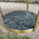 Round dining table with green marble and solid brass.