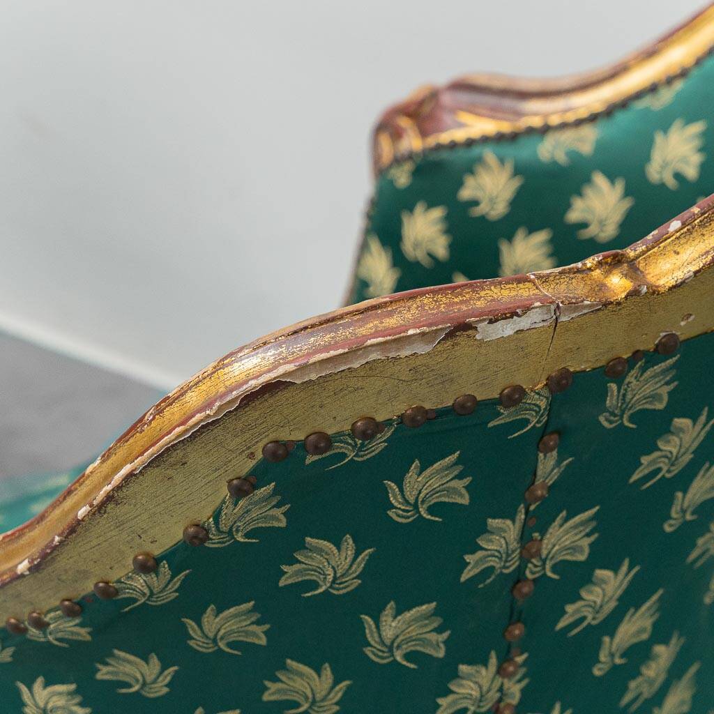 Pair of Louis XV style gilded armchairs with vintage green fabric