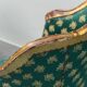 Pair of Louis XV style gilded armchairs with vintage green fabric