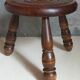 Low tripod stool in vintage turned solid wood